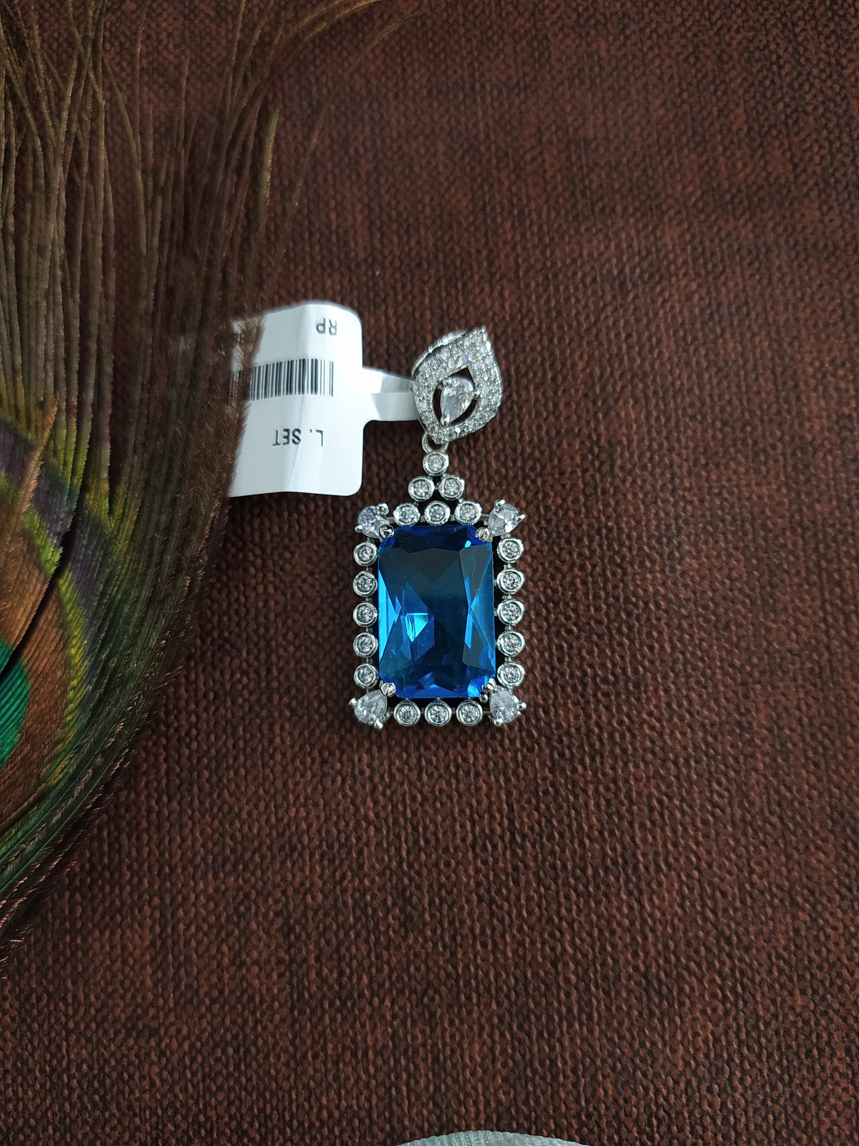 Rhodium Plated Pendant Set with Aqua Blue and Zircon Stones